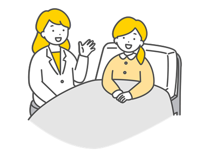 ベッドで説明を聞く女性